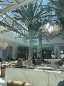 The view from my seat at RH Palm Court restaurant incuded a wide marble wall and a cascading marble fountain underneath a wide skylight