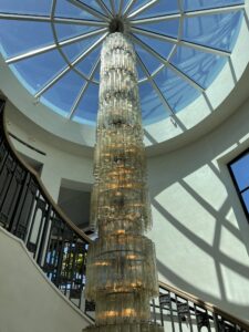 RH San Francisco interior spiral staircase with chandelier