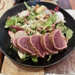 Belgian endive salad with coriander-crusted tuna on the table at Credo San Francisco