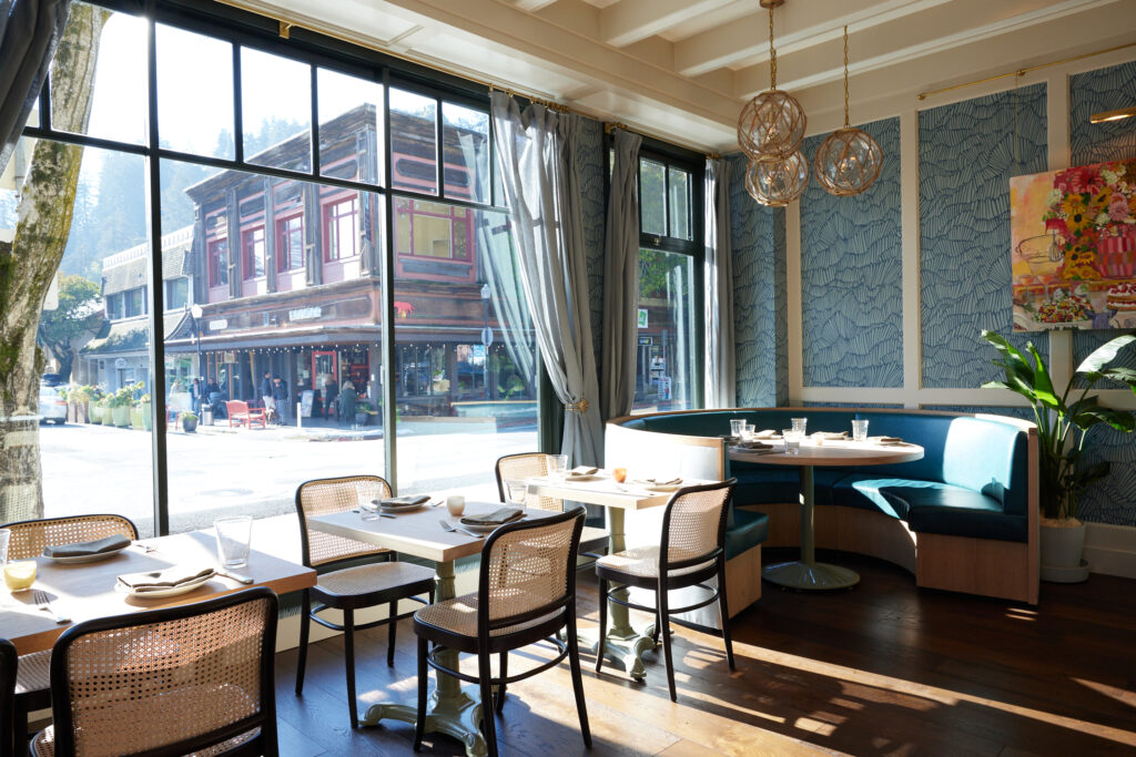Coho's dining rom features huge bay windows and a beachy-townie vibe.