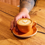 New Oakland coffee bar, the Caffe by Mr. Espresso serves lattes over a gorgeous oak bar