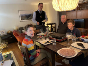 my family about to enjoy raclette at Thanksgiving