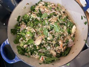 crab fried rice with spinach in a cast iron pan
