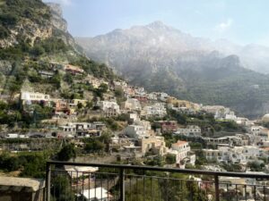 Amalfi hills dotted with houses and lemon trees, as seen from our tour bus
