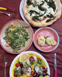 An overhead shot of our 35 euro meal (risotto, pizza, salad, fried zucchini) also included wine