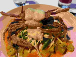 gluten-free soft shell crab is draped in curry sauce