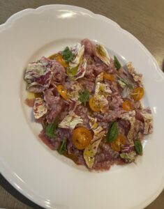 tuna carpaccio with burnt sungold tomatoes and castelfranco chicory at Violetto in Saint Helena