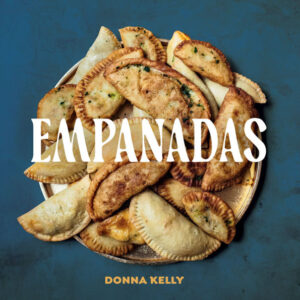 Empanadas cookbook cover shows a tray filled with empanadas_by Donna Kelly