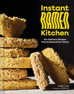 Instant Ramen Kitchen cookbook cover shows stacks of uncooked ramen noodles_by Peter Kim