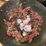 The recipe for Kampot noodles with coconut fish sauce dressing calls for stir-frying beef