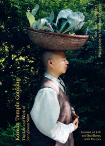 Korean Temple Cooking cookbook cover_by Hoo Nam Seelmann shows Buddhist monk Jeongkwan Snim with a basket of greens balanced on her head
