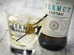 VERMUTH BLANCO LUSTAU with a glass and an olive in it