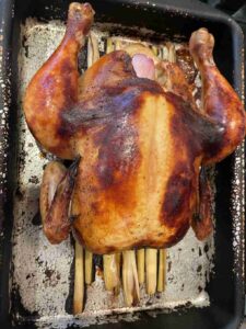 coca-cola chicken rests on a bed of lemongrass, infusing the meat with delicious flavor