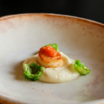 Seared Scallop from Chef Preeti Mistry's Chef's Table at Napa's Silver Oak Winery atop vanilla-infused parsnip puree