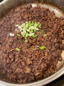 honey sesame ginger beef in the pan