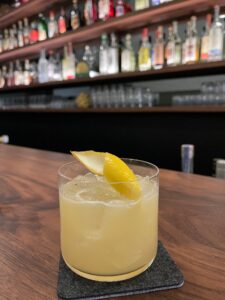 penicillin cocktail with a lemon twist on the bar at Bistro Lagniappe in Healdsburg