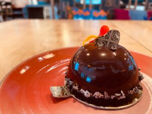 opera cake on a red plate at Little Saint restaurant in Healdsburg