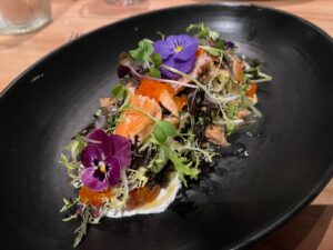 smoked trout at Spoonbar restaurant is dressed with flowers