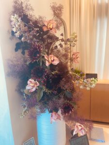 orchids and smoke plant and sunflowers make a stunning bouquet