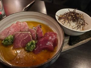 three colors of bluefin sashimi and a bowl of rice