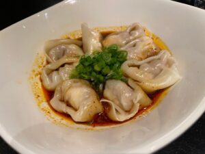 Spicy Wontons in a white bowl at Din Tai Fung, Santa Clara restaurant