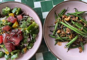 on the left - crispy quinoa and poke salad. On the right - sauteed green beans at Valley Goat, Santa Clara restaurant