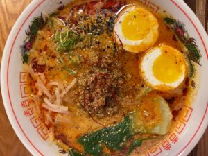 tan Tan Ramen with eggs, noodles and herbs at Chonmage Ramen restaurant, Marin