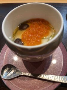 chawanmushi topped with ikura and slices of truffle at Kappo Yuji restaurant San Francisco