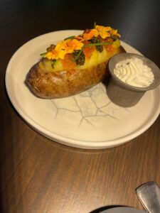 BOA “Boujee” Baked Potato topped with crème fraîche, chives and caviar at BOA Steakhouse in Napa