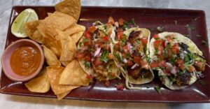 Fish tacos all in a row with chips and salsa at Maggie & Mac's restaurant San Francisco Inner Sunset