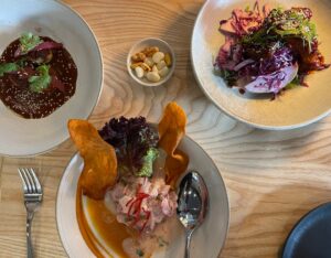 three dishes and a small dish of nibbles at Casa Sofia restaurant SoMa San Francisco