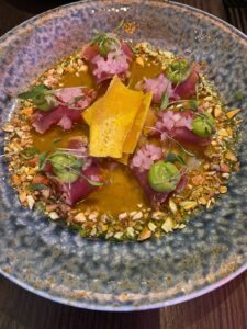 A dish of tuna tataki tiradito with plantains and cilantro at San Francisco's KAIYO Handroll Bar