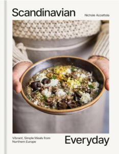 Scandinavian Everyday cookbook cover by Nichole Accettola shows a bowl of stew in a cook's hands