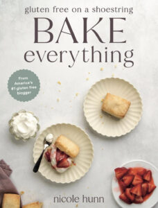 cover image for Nicole Hunn's Gluten-free on a Shoestring Bake Everything with strawberry shortcakes on the cover on scalloped plates